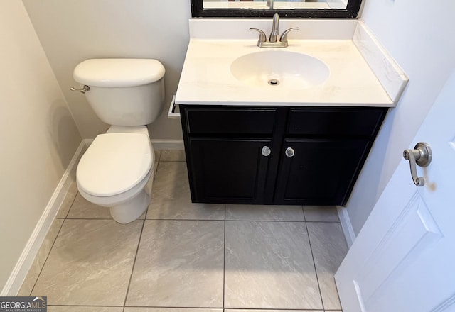417 Bell Flower Trl, Locust Grove, GA 30248 - bathroom featuring tile patterned flooring, baseboards, toilet, and vanity