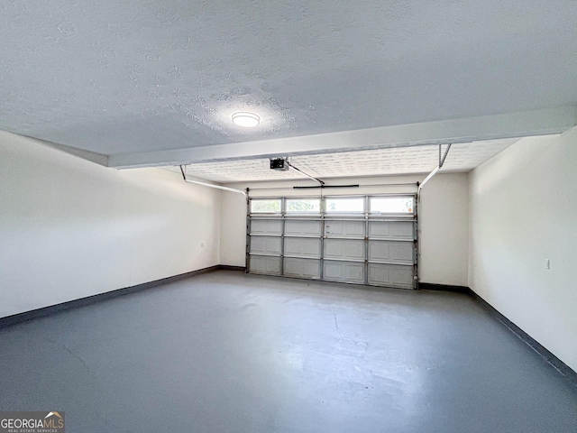 417 Bell Flower Trl, Locust Grove, GA 30248 - garage with baseboards and a garage door opener