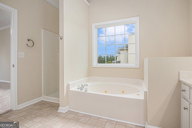 bathroom with a shower stall, tile patterned floors, a whirlpool tub, vanity, and baseboards