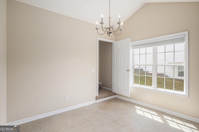 unfurnished room with high vaulted ceiling, baseboards, and a notable chandelier