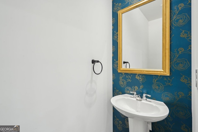 2946 Stockholm Way, Suwanee, GA 30024 - bathroom featuring wallpapered walls and a sink