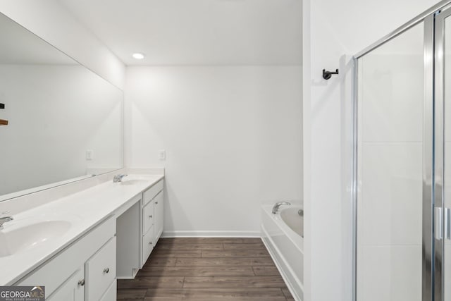 2946 Stockholm Way, Suwanee, GA 30024 - full bath with a bath, a sink, double vanity, a stall shower, and wood finished floors