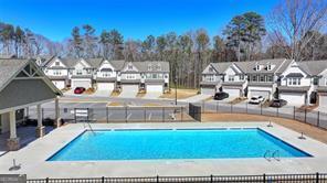 2946 Stockholm Way, Suwanee, GA 30024 - community pool featuring a residential view, a patio, and fence