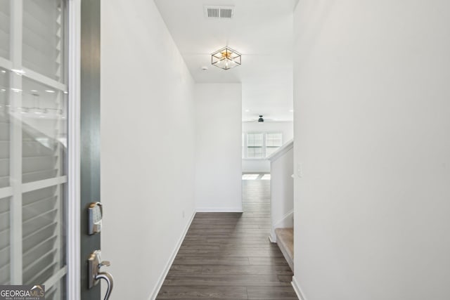 2946 Stockholm Way, Suwanee, GA 30024 - corridor with dark wood finished floors, stairway, visible vents, and baseboards