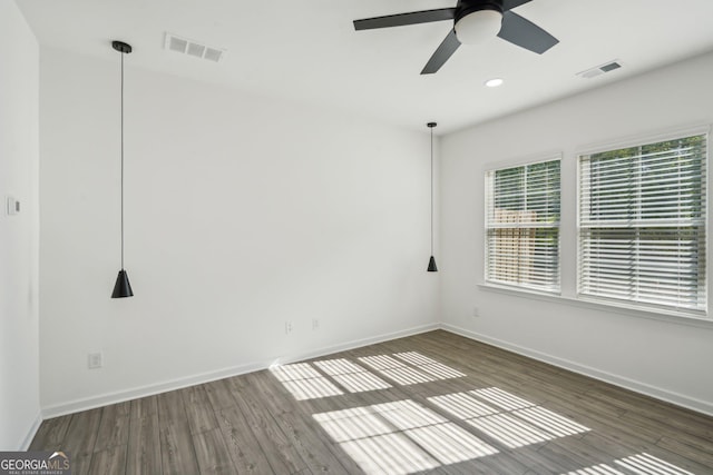 2946 Stockholm Way, Suwanee, GA 30024 - empty room with a wealth of natural light, visible vents, and baseboards