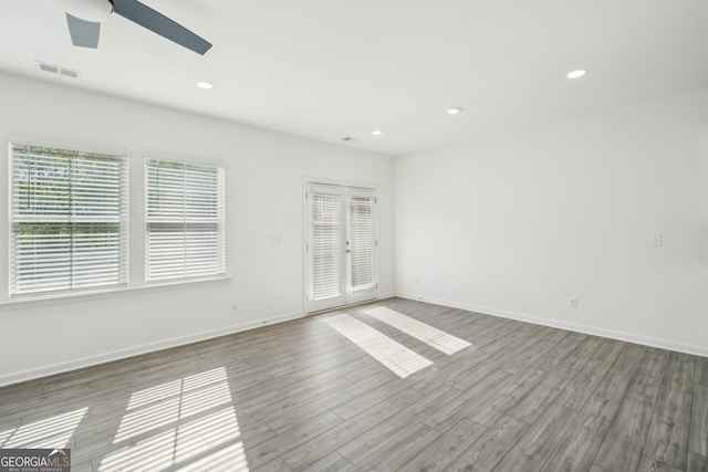 2946 Stockholm Way, Suwanee, GA 30024 - spare room featuring a ceiling fan, wood finished floors, baseboards, visible vents, and recessed lighting