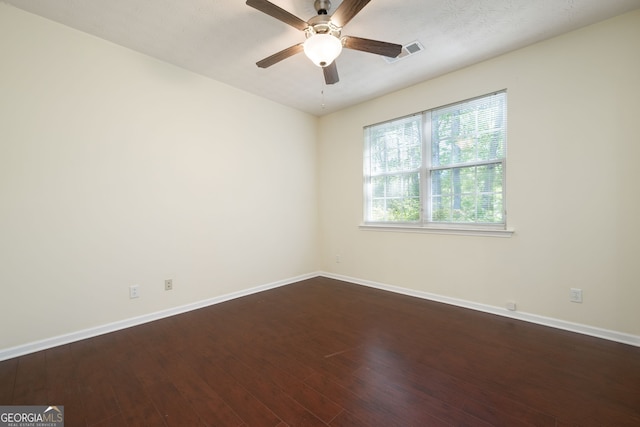548 W Oaks Dr, Woodstock, GA 30188 - empty room with visible vents, baseboards, a ceiling fan, and wood finished floors