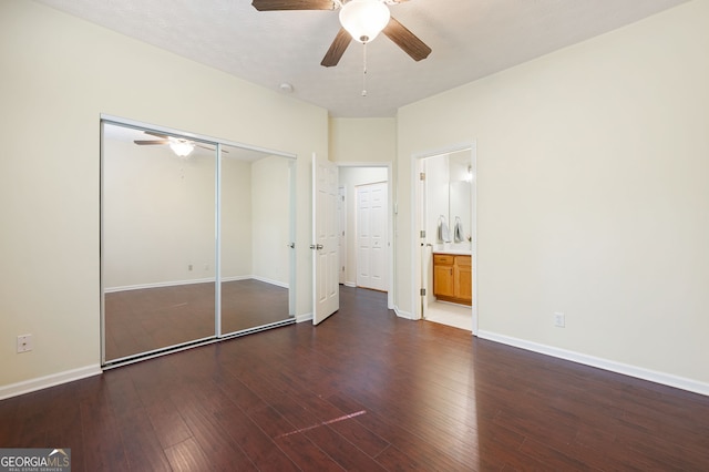 548 W Oaks Dr, Woodstock, GA 30188 - unfurnished bedroom featuring wood-type flooring, a closet, ensuite bath, baseboards, and ceiling fan