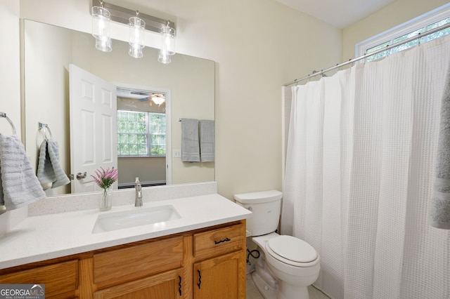 548 W Oaks Dr, Woodstock, GA 30188 - full bath with a shower with shower curtain, toilet, vanity, and ceiling fan