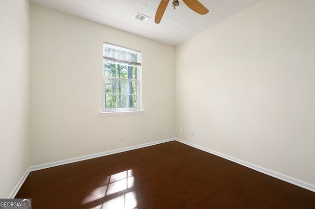 548 W Oaks Dr, Woodstock, GA 30188 - spare room with dark wood finished floors, baseboards, a ceiling fan, and visible vents