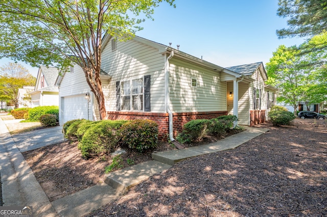 548 W Oaks Dr, Woodstock, GA 30188 - view of front facade with concrete driveway, an attached garage, and brick siding