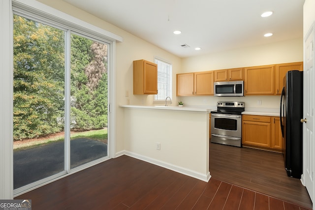 548 W Oaks Dr, Woodstock, GA 30188 - kitchen featuring light countertops, visible vents, dark wood-type flooring, baseboards, and appliances with stainless steel finishes