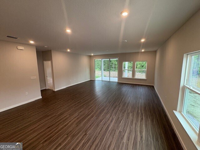 211 Park View Ln, Kingsland, GA 31548 - empty room with dark wood finished floors, baseboards, healthy amount of natural light, and recessed lighting