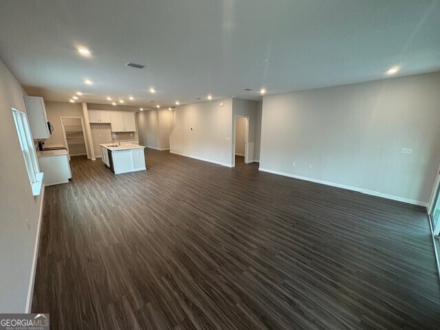 211 Park View Ln, Kingsland, GA 31548 - unfurnished living room with recessed lighting, baseboards, and dark wood finished floors