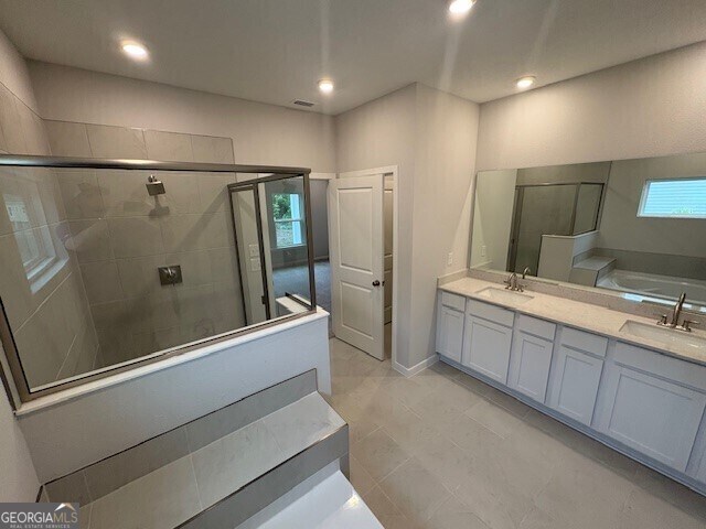 211 Park View Ln, Kingsland, GA 31548 - full bath with a stall shower, double vanity, a garden tub, and recessed lighting