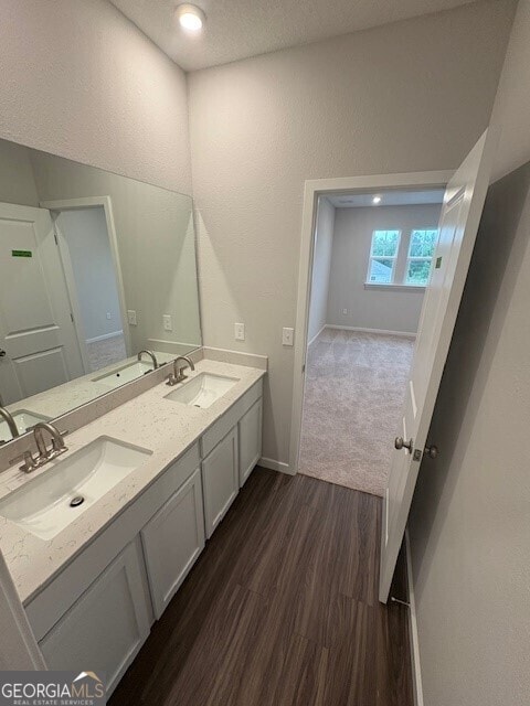 211 Park View Ln, Kingsland, GA 31548 - bathroom with wood finished floors, double vanity, and baseboards
