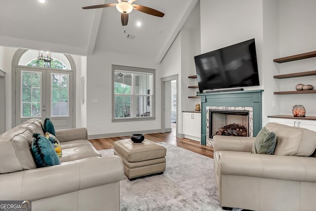 303 Wilsons Creek Bnd, Bonaire, GA 31005 - living area featuring recessed lighting, light wood-style flooring, ceiling fan with notable chandelier, a premium fireplace, and french doors