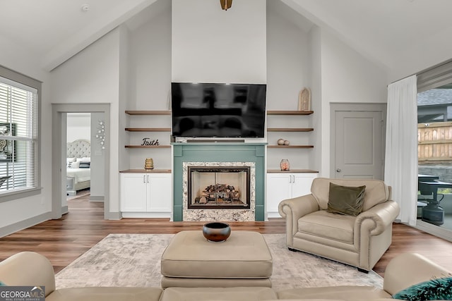 303 Wilsons Creek Bnd, Bonaire, GA 31005 - living area featuring a fireplace, wood finished floors, and high vaulted ceiling