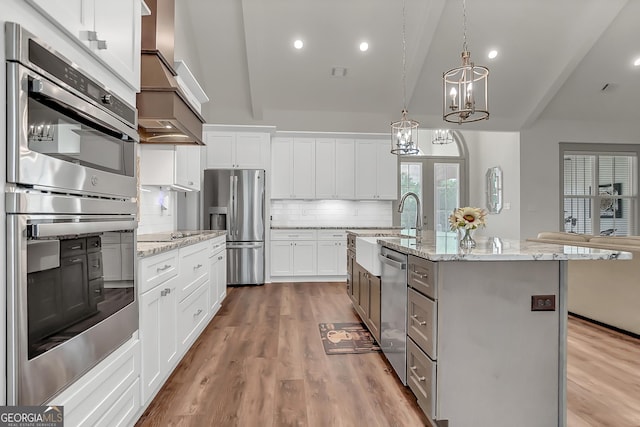 303 Wilsons Creek Bnd, Bonaire, GA 31005 - kitchen with a sink, appliances with stainless steel finishes, wood finished floors, a notable chandelier, and backsplash