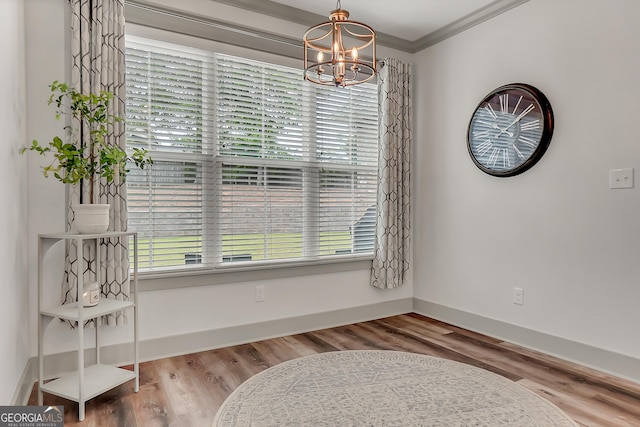 303 Wilsons Creek Bnd, Bonaire, GA 31005 - dining area featuring a chandelier, wood finished floors, crown molding, and plenty of natural light