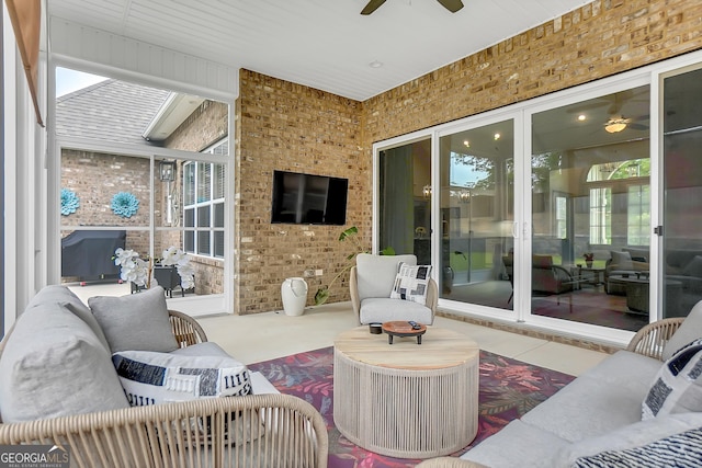 303 Wilsons Creek Bnd, Bonaire, GA 31005 - sunroom with ceiling fan and brick wall
