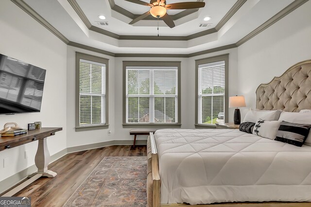 303 Wilsons Creek Bnd, Bonaire, GA 31005 - bedroom featuring ornamental molding, visible vents, wood finished floors, and a tray ceiling