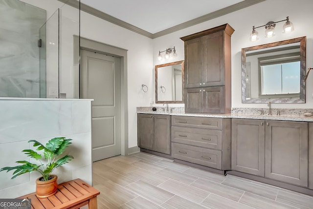 303 Wilsons Creek Bnd, Bonaire, GA 31005 - full bathroom with double vanity, a shower with shower door, crown molding, and a sink