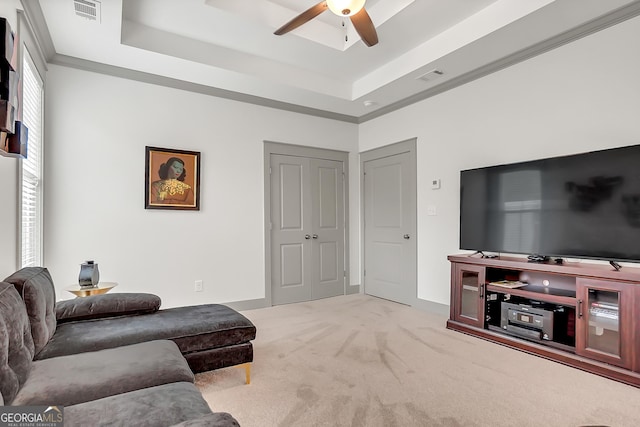 303 Wilsons Creek Bnd, Bonaire, GA 31005 - living room with visible vents, ceiling fan, carpet floors, and a tray ceiling