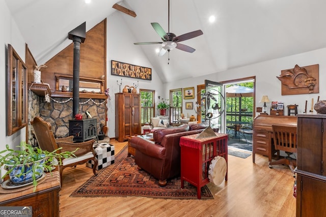 511 Oakdale Rd, Canton, GA 30114 - living area featuring a wood stove, plenty of natural light, light wood-style flooring, and high vaulted ceiling