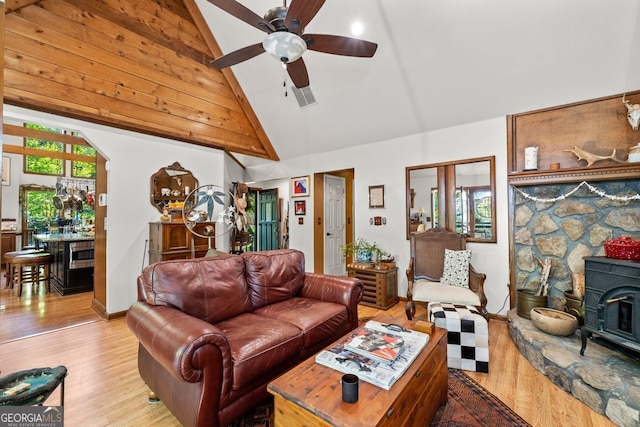 511 Oakdale Rd, Canton, GA 30114 - living room with a wood stove, wood finished floors, ceiling fan, and high vaulted ceiling