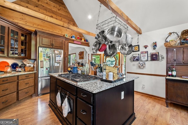 511 Oakdale Rd, Canton, GA 30114 - kitchen with stainless steel appliances, light stone counters, glass insert cabinets, and light wood-style floors