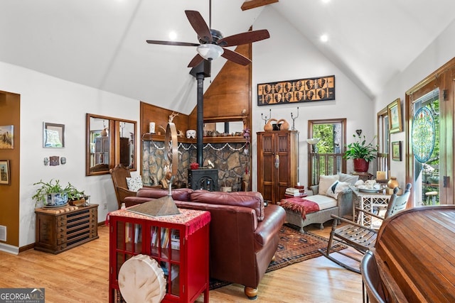 511 Oakdale Rd, Canton, GA 30114 - living area with a wood stove, light wood-type flooring, a ceiling fan, and high vaulted ceiling