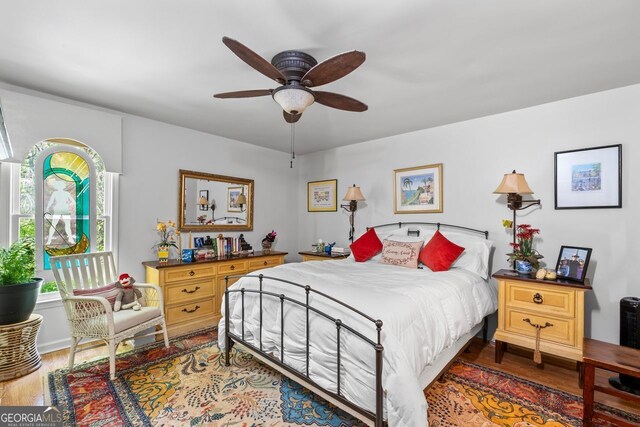 511 Oakdale Rd, Canton, GA 30114 - bedroom with a ceiling fan and wood finished floors