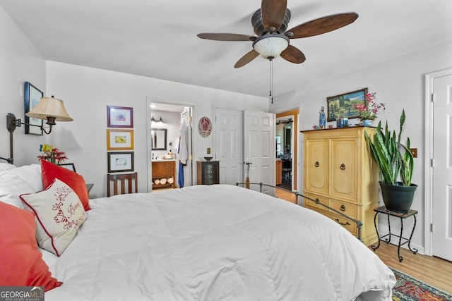 511 Oakdale Rd, Canton, GA 30114 - bedroom featuring ensuite bathroom, wood finished floors, and a ceiling fan