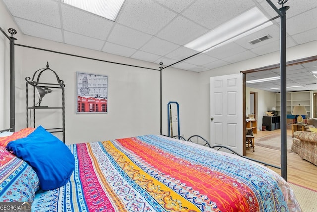 511 Oakdale Rd, Canton, GA 30114 - bedroom with a paneled ceiling, visible vents, and wood finished floors