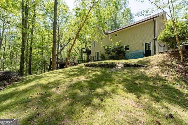 511 Oakdale Rd, Canton, GA 30114 - view of yard featuring a deck and central AC