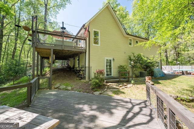 511 Oakdale Rd, Canton, GA 30114 - back of house with central air condition unit and a wooden deck