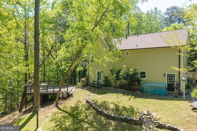 511 Oakdale Rd, Canton, GA 30114 - rear view of property with a yard, a wooden deck, and central AC unit