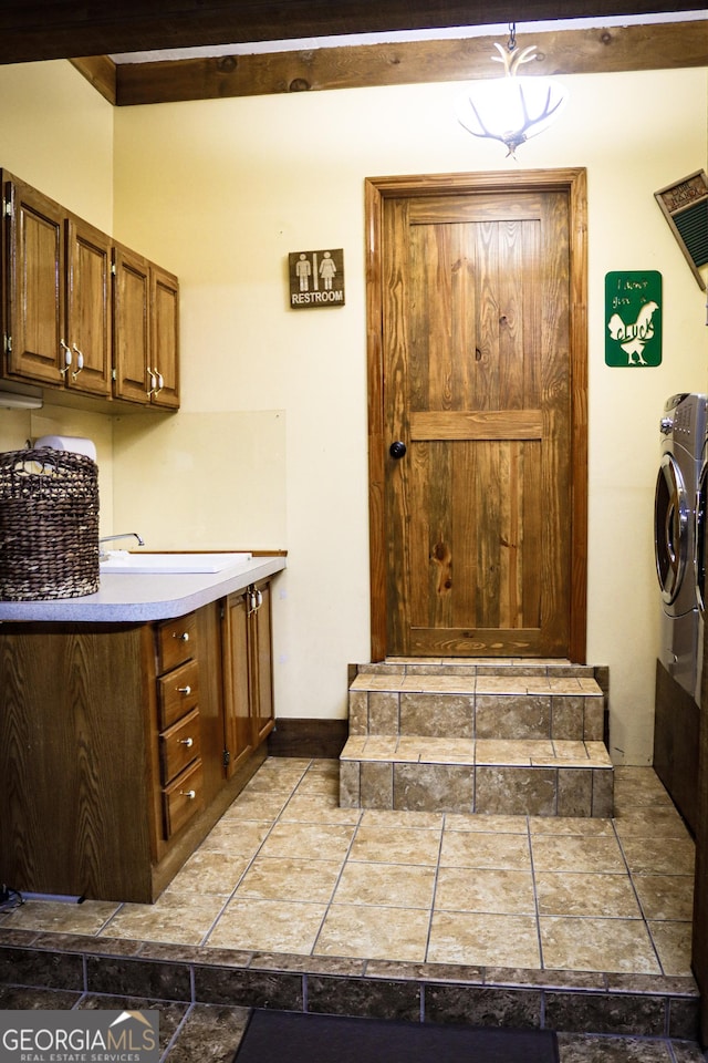 5524 Hooker Branch Rd, Millen, GA 30442 - washroom with separate washer and dryer, cabinet space, and baseboards