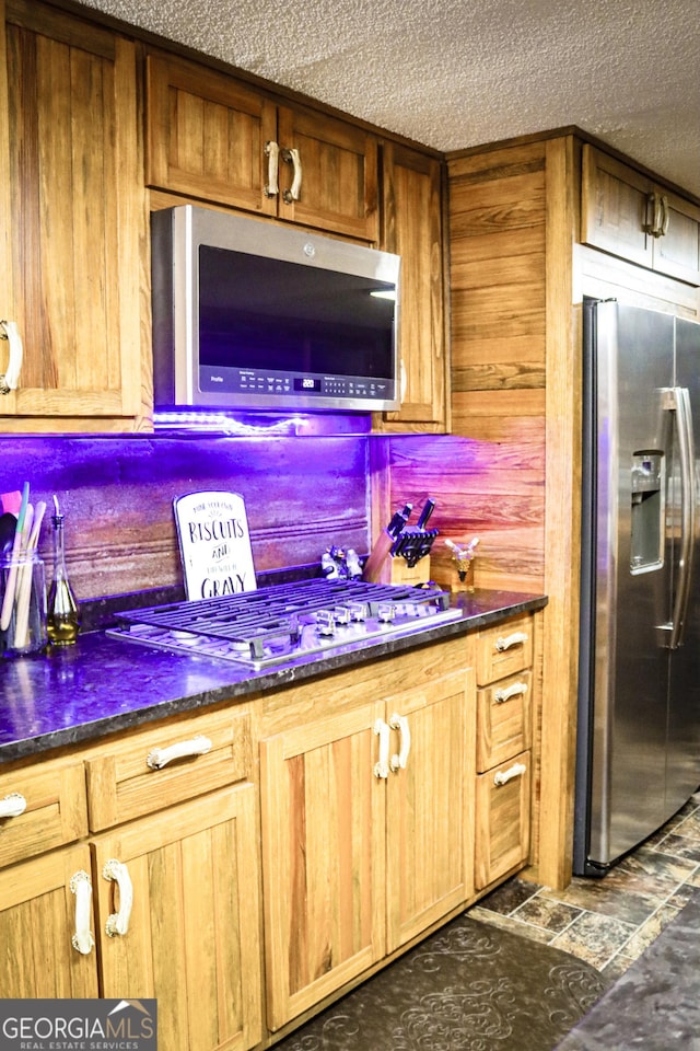 5524 Hooker Branch Rd, Millen, GA 30442 - bar featuring appliances with stainless steel finishes, a textured ceiling, and wood walls