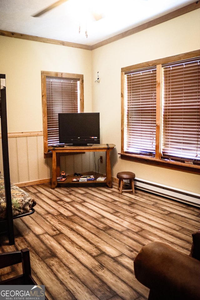 5524 Hooker Branch Rd, Millen, GA 30442 - office area featuring a baseboard heating unit, wood finished floors, and crown molding