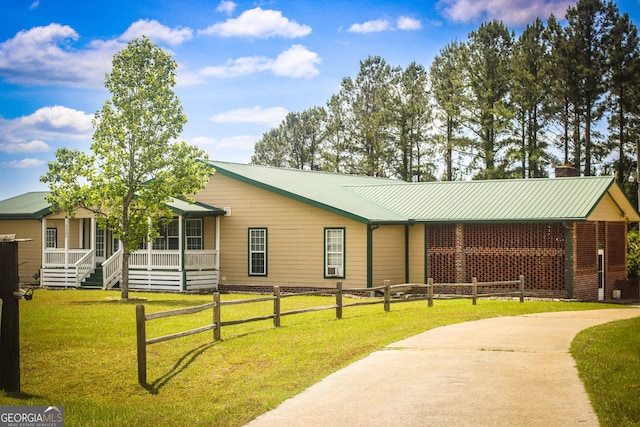 5524 Hooker Branch Rd, Millen, GA 30442 - view of front of home with a porch, a chimney, metal roof, and driveway
