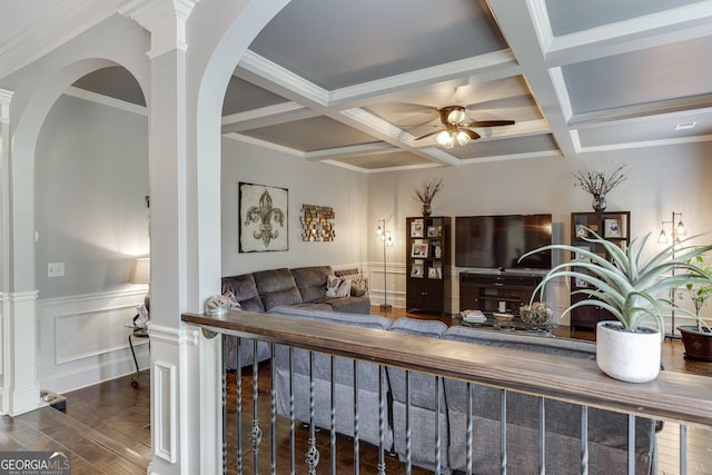 3097 Trinity Grove Dr, Dacula, GA 30019 - living area with beamed ceiling, wood-type flooring, coffered ceiling, a ceiling fan, and wainscoting