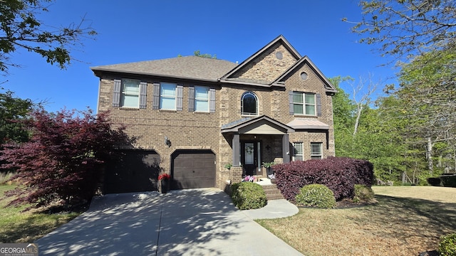 3097 Trinity Grove Dr, Dacula, GA 30019 - traditional home with a garage, brick siding, and concrete driveway