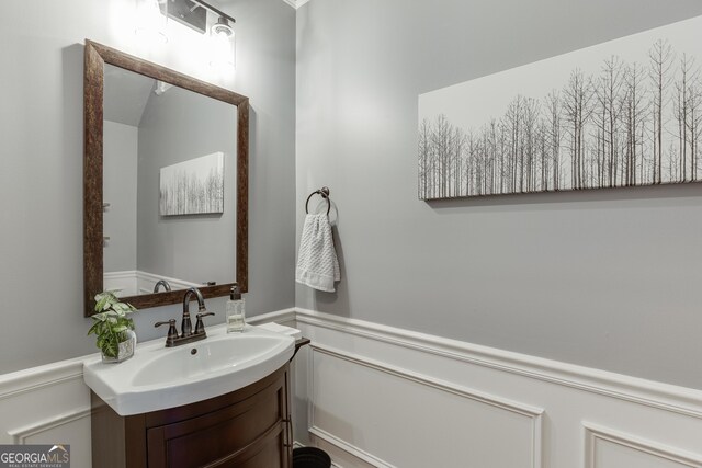 3097 Trinity Grove Dr, Dacula, GA 30019 - bathroom featuring a wainscoted wall and vanity