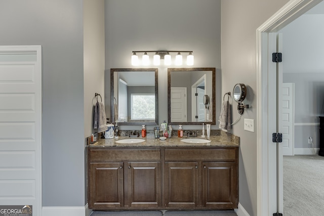 3097 Trinity Grove Dr, Dacula, GA 30019 - full bathroom featuring baseboards, double vanity, and a sink