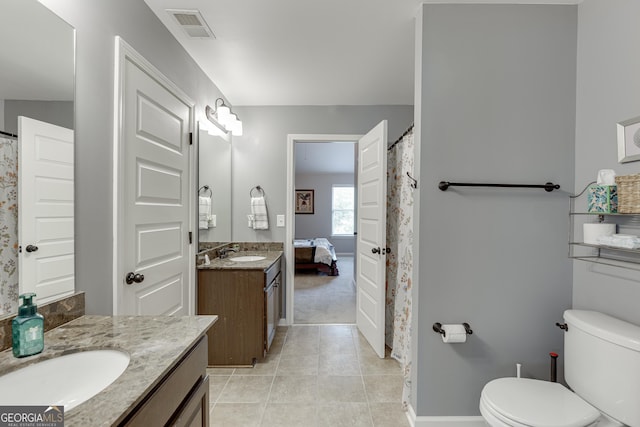 3097 Trinity Grove Dr, Dacula, GA 30019 - bathroom with two vanities, visible vents, toilet, and a sink