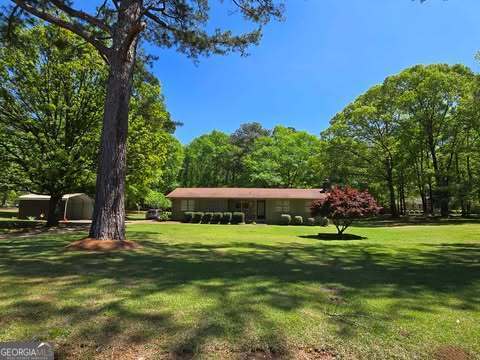 view of property's community with a lawn