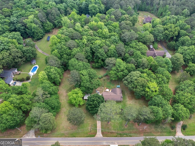 drone / aerial view with a view of trees