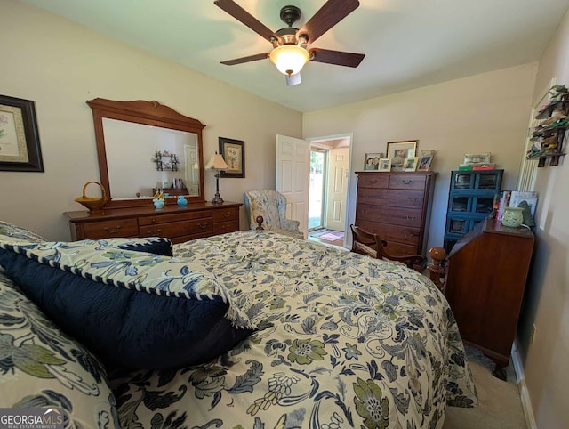 bedroom featuring baseboards, a ceiling fan, and carpet flooring